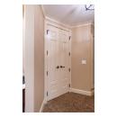 A pair of TS3100 doors in MDF with Roman Ogee sticking and Scoop (B) panel lead to the bathroom suite.