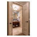 A pair of TS3100 doors in MDF with Roman Ogee sticking and Scoop (B) panel lead to the bathroom suite.