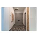A pair of TM9420 doors in MDF open to the master bedroom.