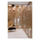 The designer added glamour to this walk-in closet by custom applying plant-ons and mirrors to TS3000 doors in MDF.