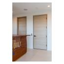 An upstairs lounge features TMF1000 flush doors in quarter sawn white oak with a custom ceruse finish.