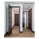This bedroom features TMIR6000 doors in mahogany with ½" bright stainless steel inlay. Builder provided stain finish.