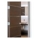 An attached bathroom features TMIR6000 doors in mahogany with ½" bright stainless steel inlay. Builder provided stain finish.