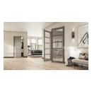 This living room features a pair of ultra narrow TMUN5000 doors in MDF with Square Stick (SS) sticking and clear glass. The door in back has a solid flat panels.
