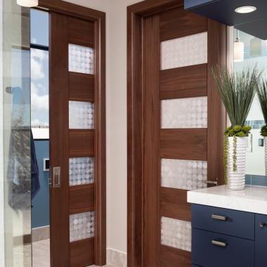 A contemporary master bath features TM9160 doors in walnut with Nutmeg stain and Capiz resin.