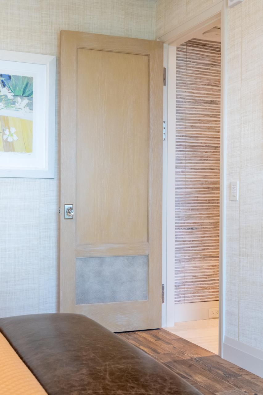 Modified TS2210 door, in wire-brushed plain sawn white oak with customer applied ceruse finish and Shagreen Grey Oyster leather.
