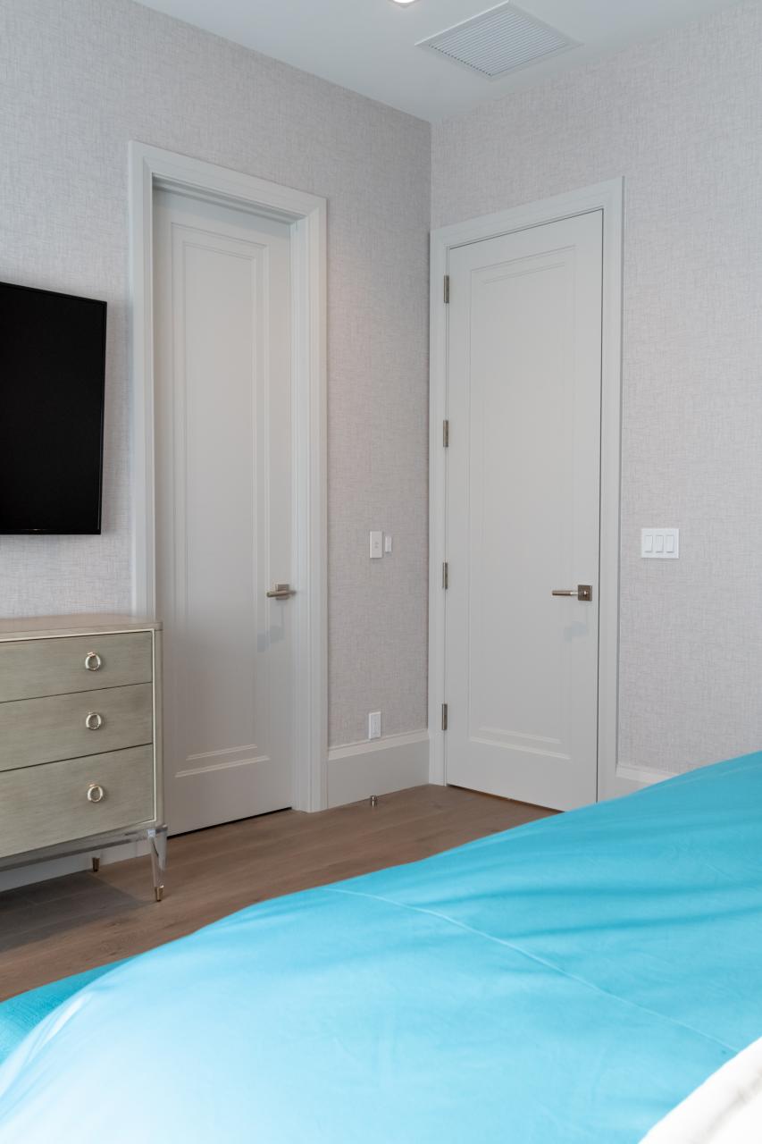 A guest room features TS1000 doors in MDF with Miracle (MR) moulding and Flat (C) panel.