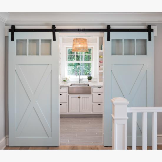 Pair of PL143 barn doors in MDF with clear glass, Square Stick (SS) sticking and custom plant-on accents.