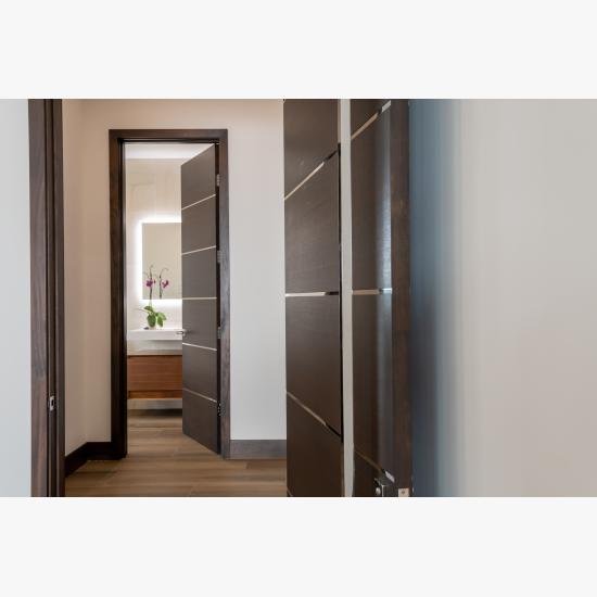 TMIR6000 doors in mahogany with ½" bright stainless steel inlays. Customer stained finish.